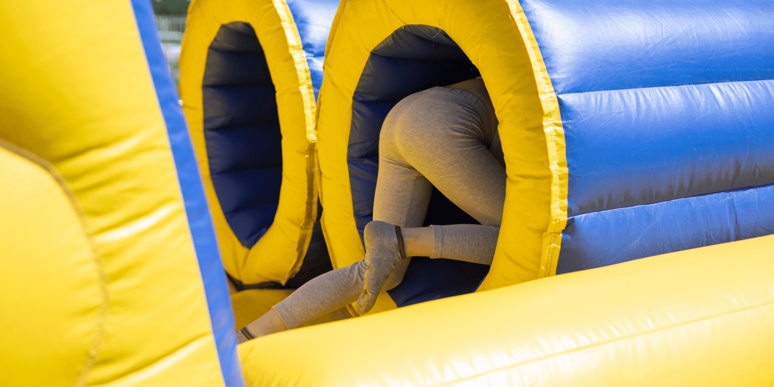 Person going through inflatable obstacle course